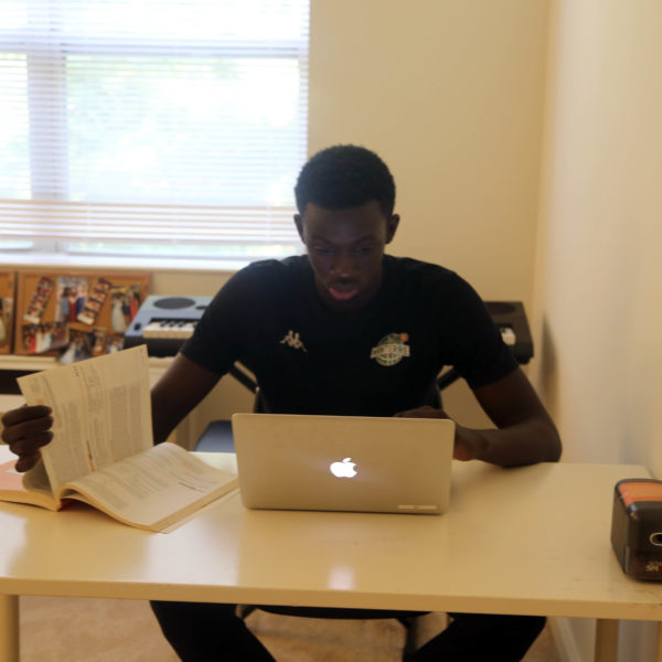 International student studying in the dorm