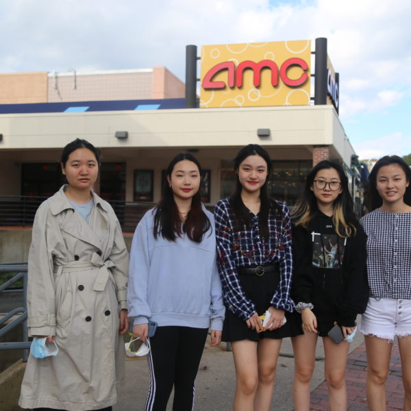 International students about to attend a movie at the theater