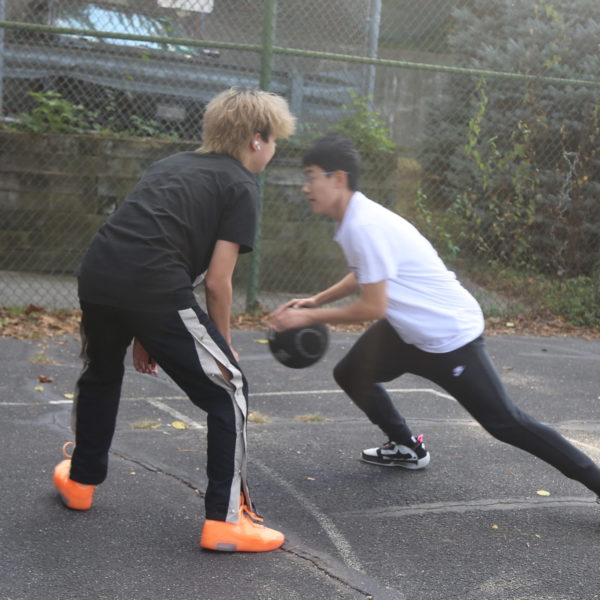International students playing basketball