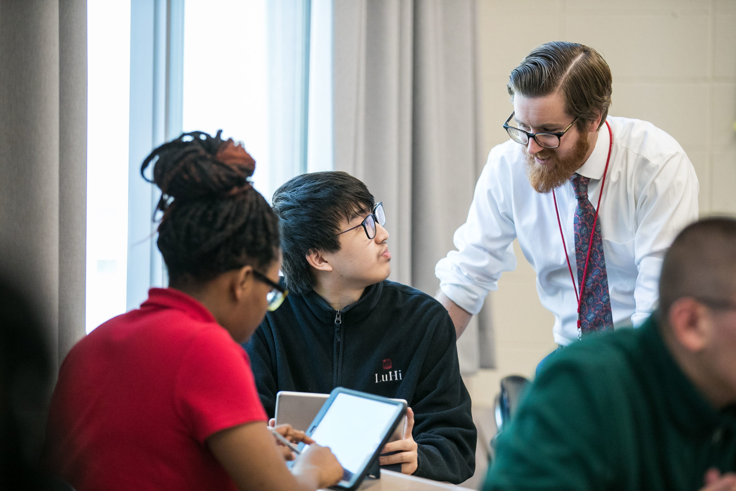 Teacher and student interacting during class