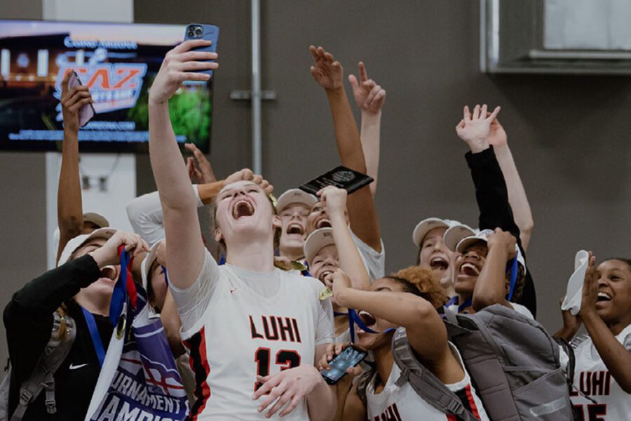 girls basketball celebrating