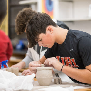 Student in ceramics class