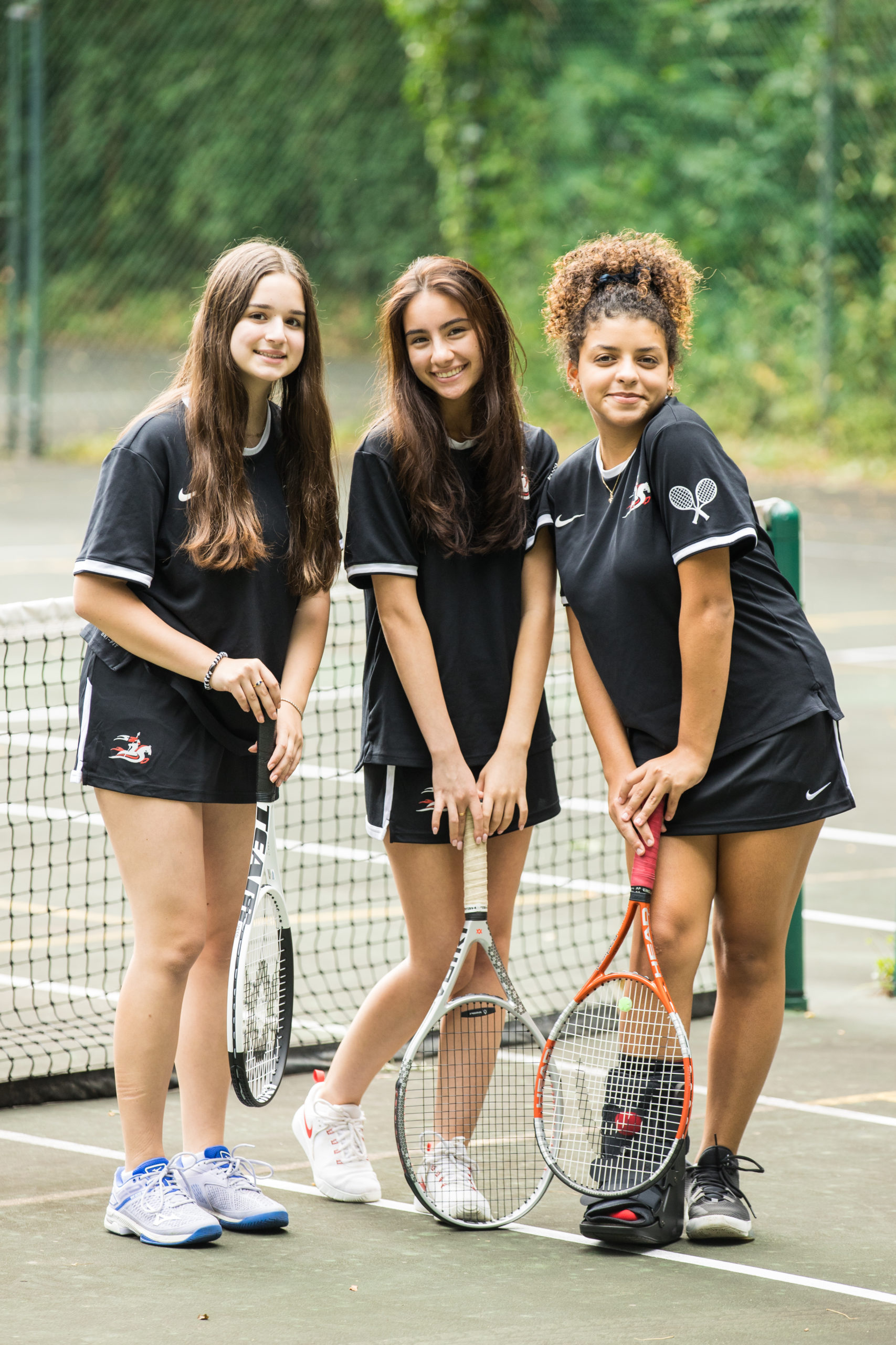 Girls Tennis players posing