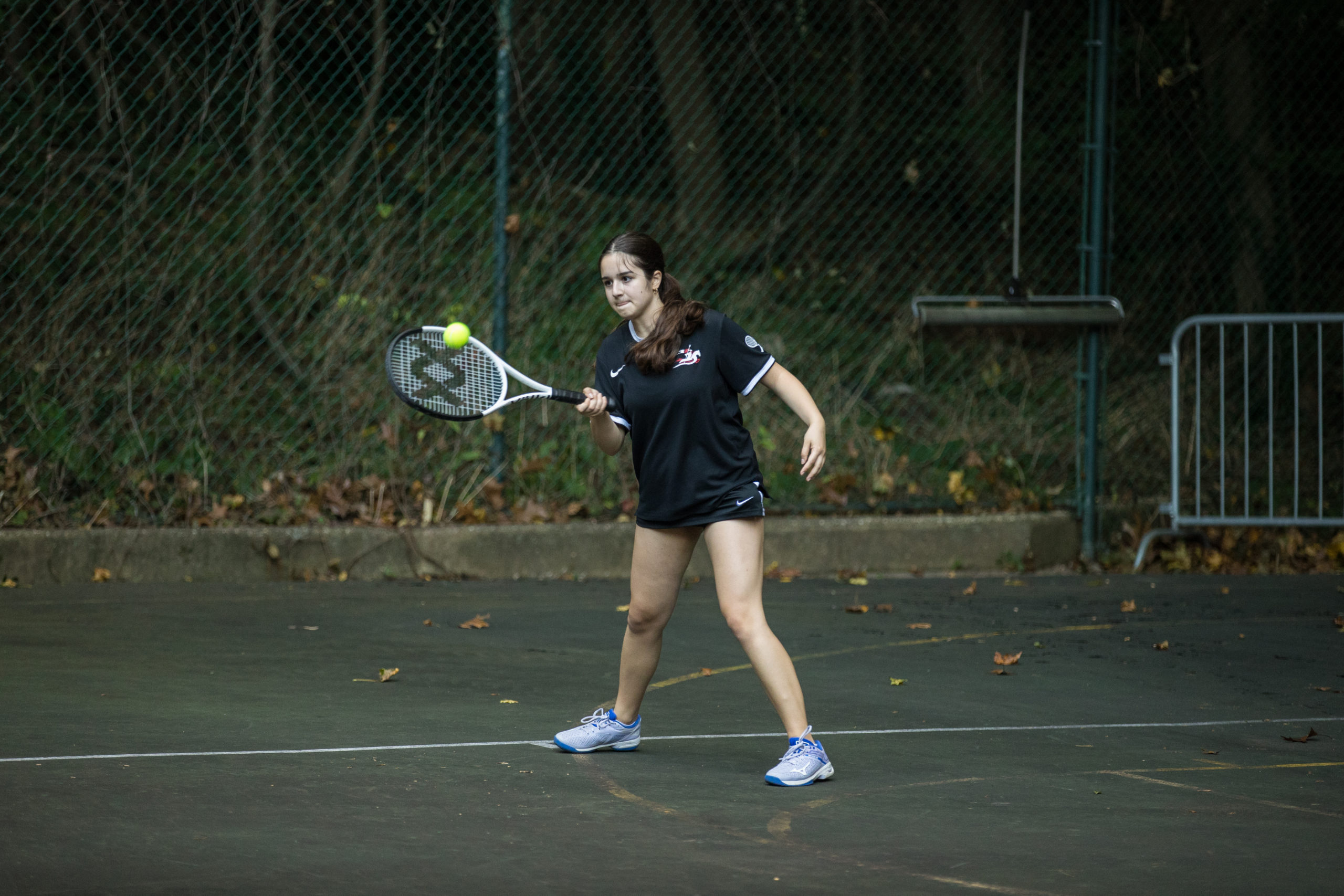 Girls Tennis Player hitting ball