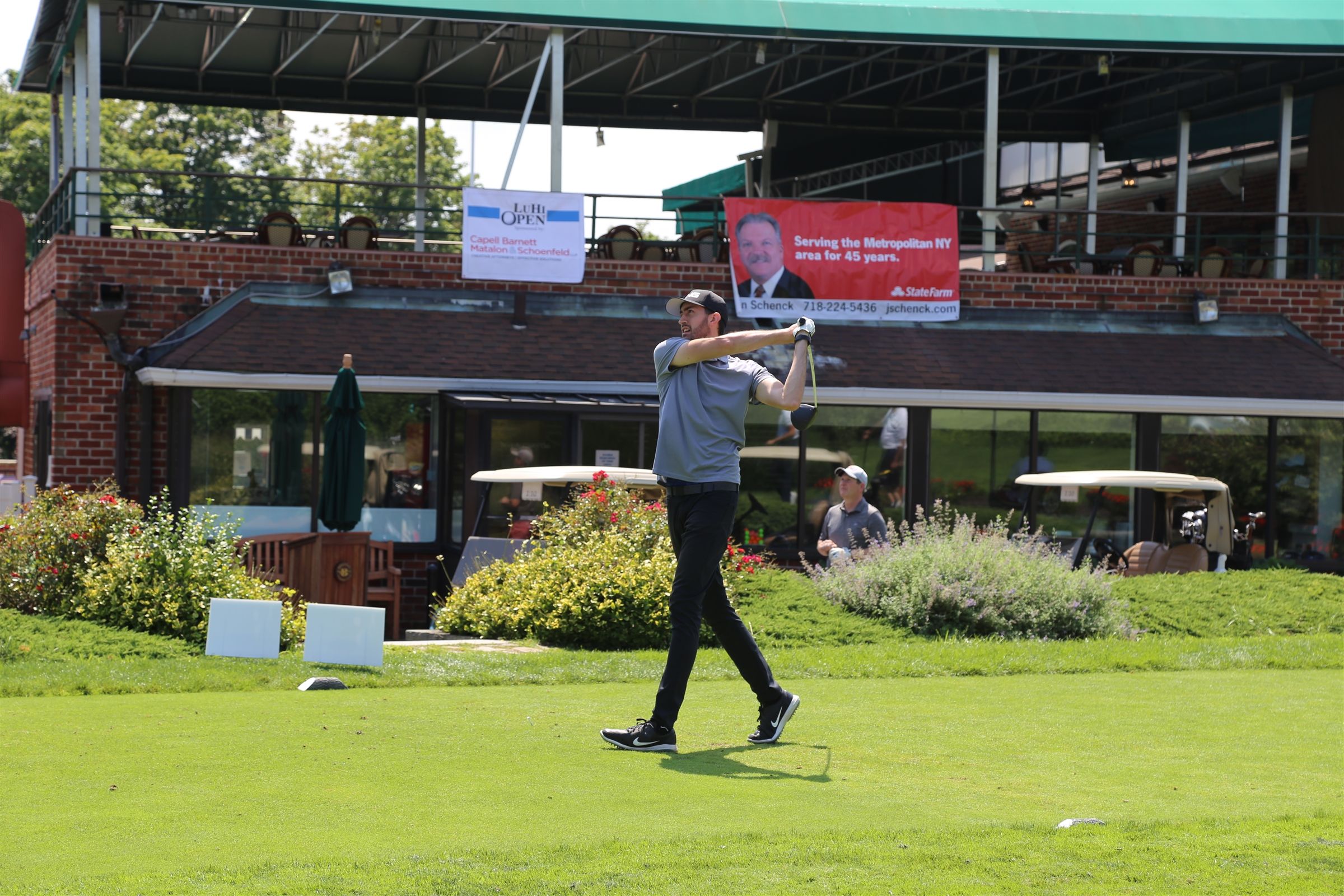 Golfer teeing off