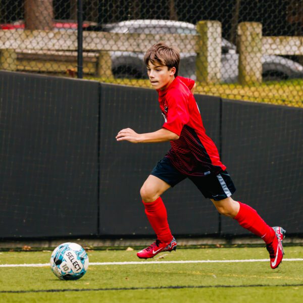 Student athlete playing soccer