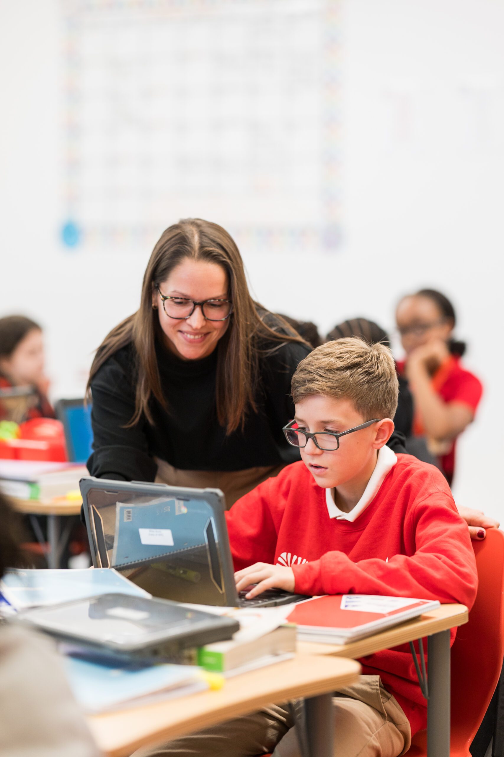 teacher working with student
