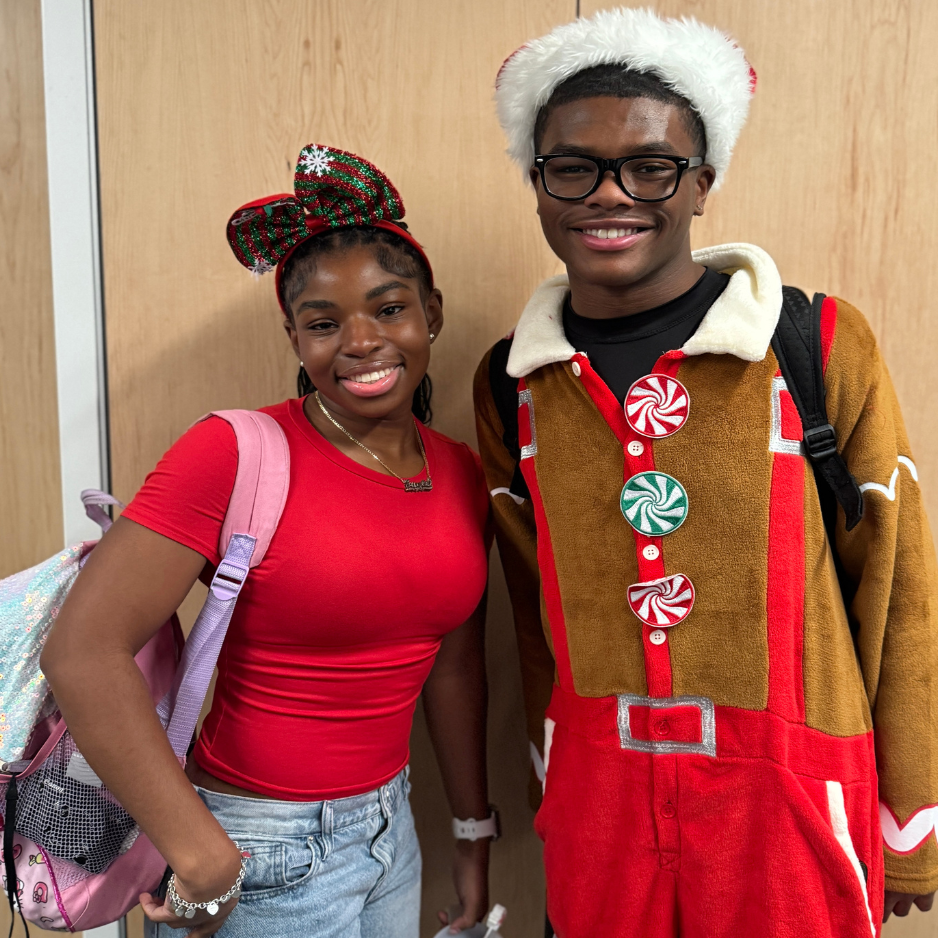 2 students dressed up for Christmas spirit week.
