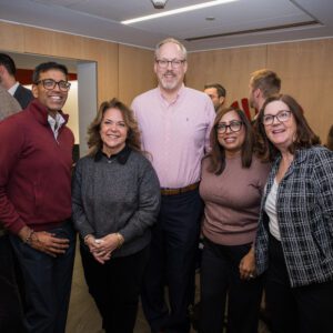 Group posing for picture at event