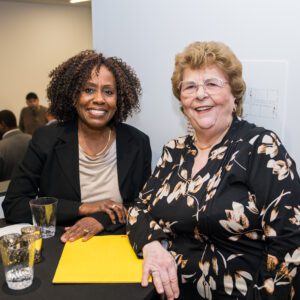 two women posing for photo