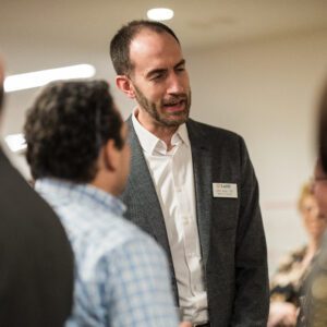 group talking and laughing at event