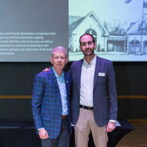John Buck posing with award recipient