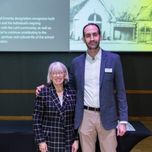 John Buck posing for picture with award recipient