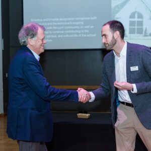 John Buck posing with award recipient