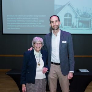John Buck posing for picture with award recipient