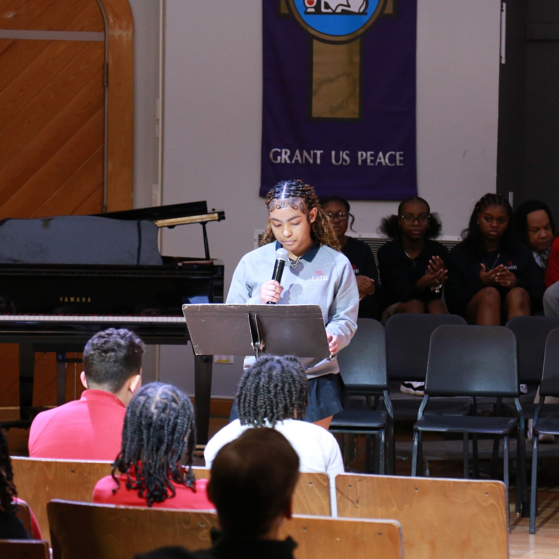 students speaking at black history month assembly