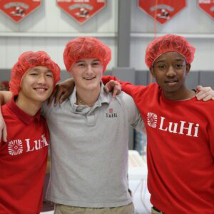 group of boys smiling with hair nets on